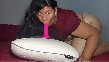 Chubby girl riding pillow with dildo