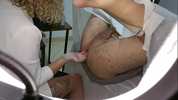 Patient goes for a prostate exam but ends up with a strapon stuck in his ass