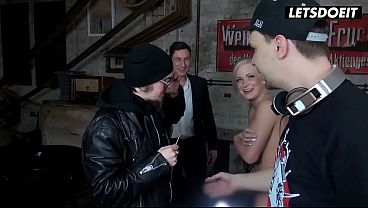 Behind the Scenes Blonde Babe Teases the Crew with Her Tits Out Waiting to See Which Cock Fucks Her