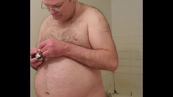 Nude Martin Lavalleacutee locks his own penis in a steel cage
