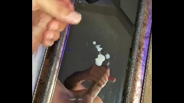 Moaning while he blows a huge cumshot on a mirror