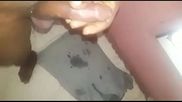 Boy rubbing his dick while standing