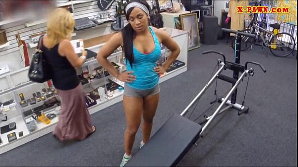 Muscular chick poses on camera and fucked in the pawnshop